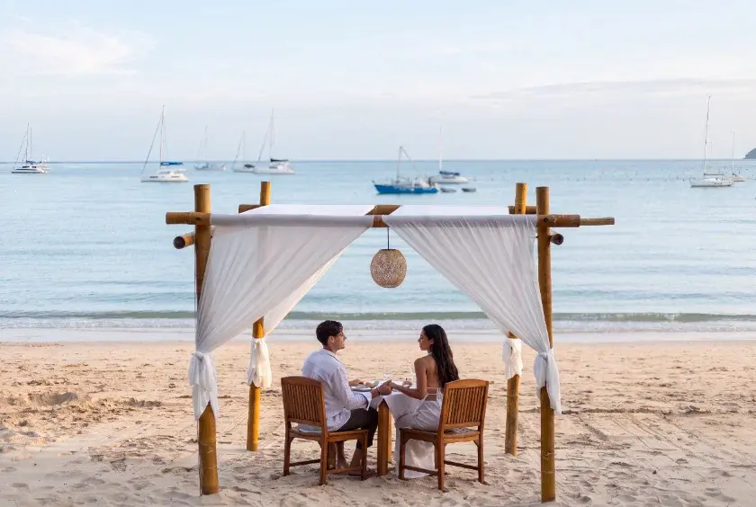 Private beach dining scene at a Thai island resort
